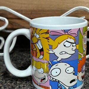 Coffee mug with Nickelodeon cartoon characters in a collage